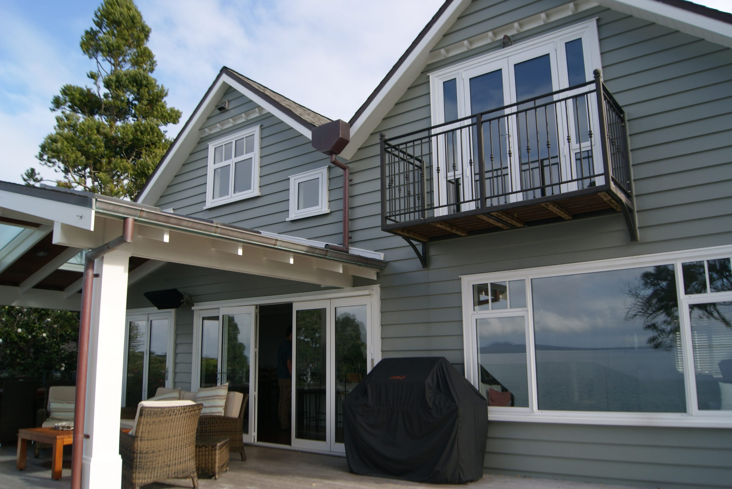 Outdoor dining and master bedroom balcony