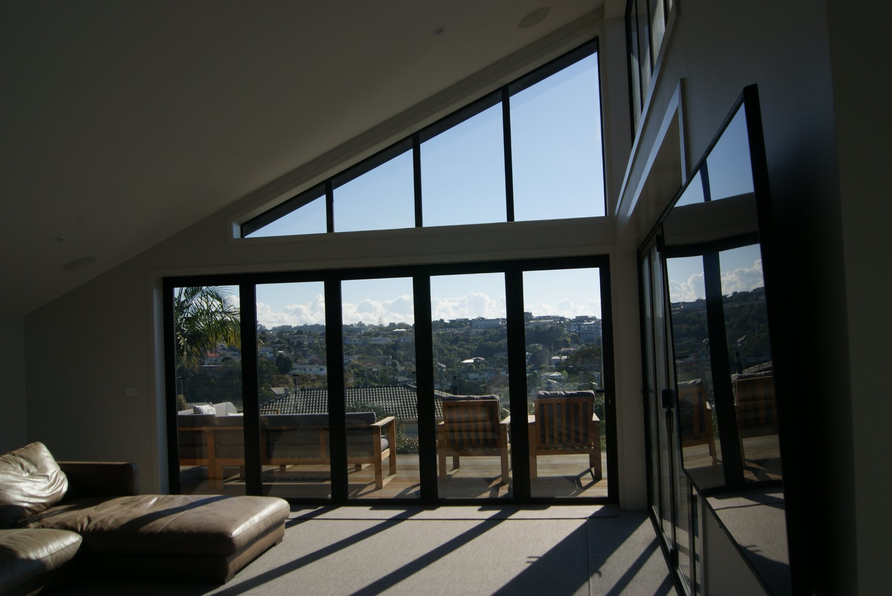 The new living room with views over Long Bay Beach